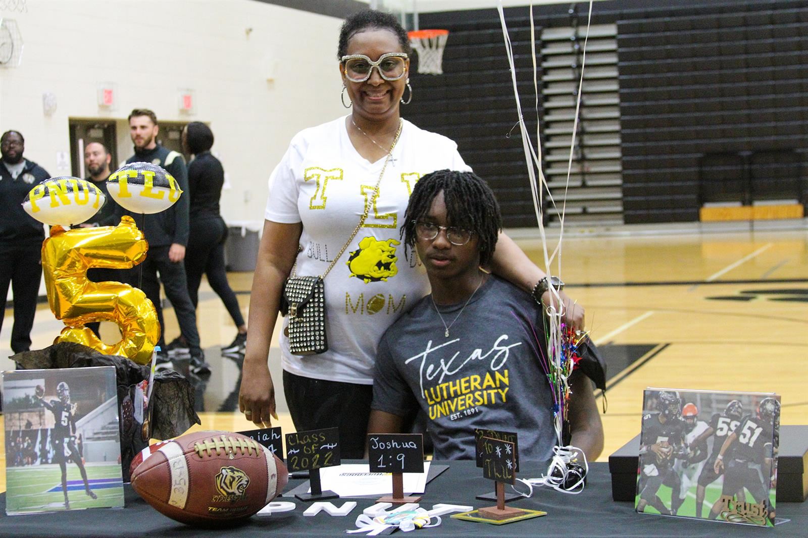 Cypress Park High School senior Edward Dixon Jr., seated, signed a letter of intent to Texas Lutheran University.